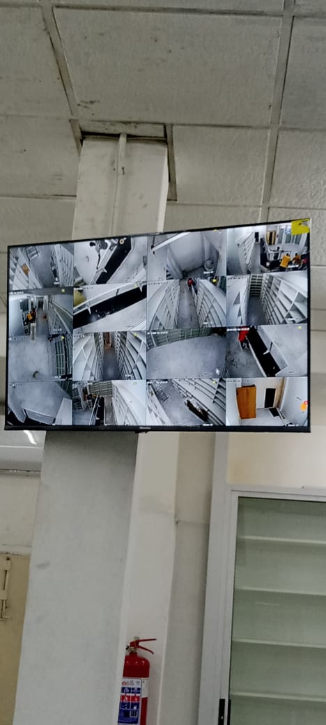 NVR monitor displaying multiple live CCTV camera feeds at a commercial property in Lusaka